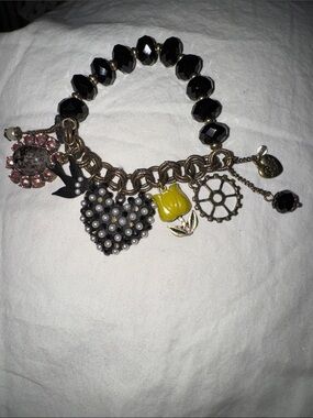 This piece is a RARE vintage Betsey Johnson Y2K COMPLETE Charm Bracelet.
